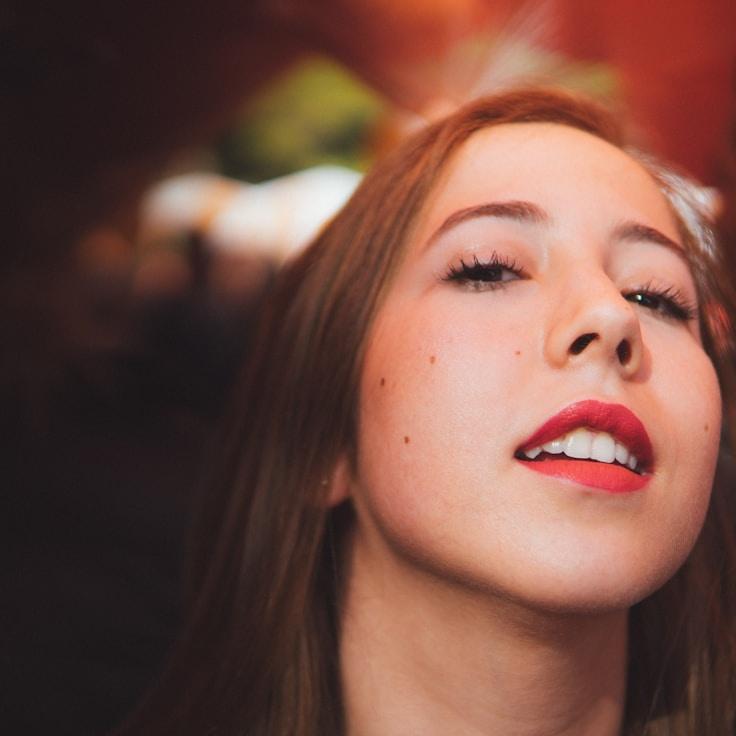 Kaveri Mehta, Lead Design Curator at Strategic Wealth Channel, reviewing corporate floral arrangements